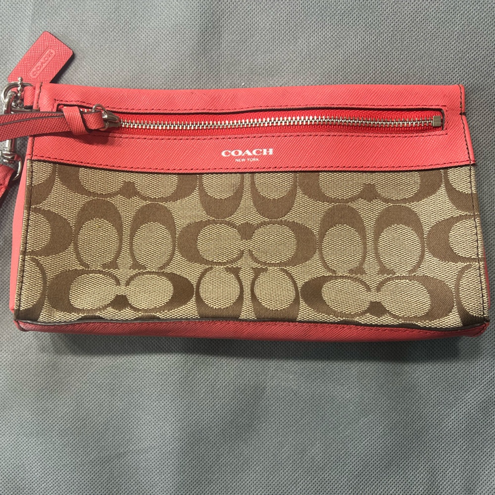 Coach. Orange and Monogram Printed Wristlet.